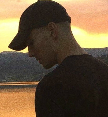 Scenic Image of Devin Riggins at a lake - American Electronic Music Artist